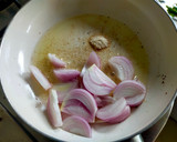 A picture of step 2 of Kanda-Lasoon Masala.