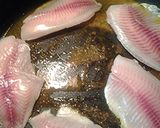 A picture of step 2 of Turmeric tilapia AKA golden tilapia.
