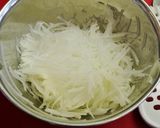 A picture of step 3 of Simple Daikon Radish & Crab Stick Salad.