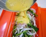 A picture of step 4 of Silicone Steamer Quiche.