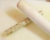 A picture of step 1 of Burdock Roots Wrapped in Kombu.
