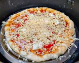 A picture of step 3 of Paneer and onion pizza.