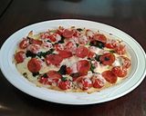 A picture of step 6 of Pizza Tomatoes.