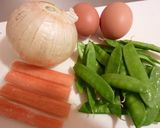 A picture of step 1 of Sweet Onion and Snow Peas with Fluffy Scrambled Eggs.