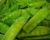A picture of step 1 of Garlic Snow Peas With Lemon Zest and Parmesan.