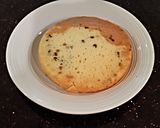 A picture of step 9 of Vanilla Chip Layer Cake with Cherry Curd Filling.