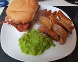 A picture of step 5 of My Mega Chicken Burger with potato wedgies and mushie peas. 😁.