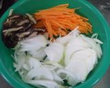 A picture of step 2 of Stir-fried Bifun Noodles with lots of Spring Cabbage and Sweet Onions.