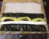 A picture of step 4 of Avocado Salmon Philadelphia Rolls.