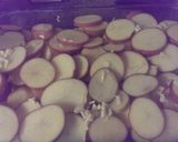 A picture of step 3 of Yummy scrummy garlicky potato bake.