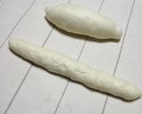 A picture of step 5 of Fluffy Powdered Snow Christmas Bread Wreath.