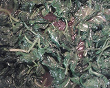 A picture of step 2 of Poached eggs on a nest of spinach.