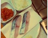 A picture of step 1 of Cod Meunière in Tomato-Onion Sauce.
