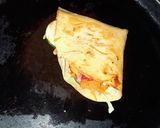 A picture of step 8 of Tortilla Wrap with egg and veggies.