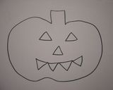 A picture of step 5 of Halloween Jack-o-Lantern made from Carrots.