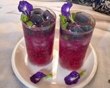 A picture of step 3 of Blue pea magic layered mocktail.