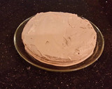 A picture of step 13 of Hazelnut Layer Cake with Hazelnut Cream Frosting.