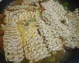 A picture of step 5 of Maggi coins with bowl of veg noodles.