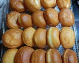 A picture of step 11 of Mardi Gras Chocolate Donuts.