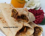 A picture of step 15 of Saucy beef wraps.