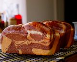 A picture of step 14 of Mini and Cute Cocoa Marble Bread | used two loaf pans.