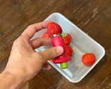 A picture of step 2 of Strawberry banana smoothie using a hand blender.