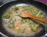A picture of step 2 of Upma with lots of veggies.