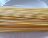 A picture of step 1 of Angel hair pasta coated fish balls.