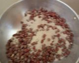 A picture of step 3 of Roasted ground nuts in a salted pan.