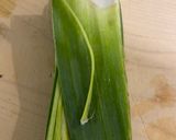 A picture of step 2 of Chicken Hearts Yakitori style (no skewer) Leek Green on top.