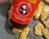 Foto del passaggio 5 della ricetta Pepite di Pollo Speziate con Salsa d’ostrica