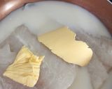 A picture of step 2 of Poached Cod with white sauce.