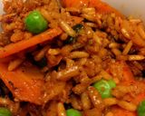 A picture of step 9 of Arroz Amarillo con Carnitas/ Achiote Rice Supper with Pork Carnitas.