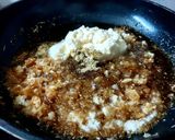 A picture of step 1 of Rosho Puli Pithe with Khejur Gur.