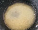A picture of step 1 of Vasant Panchami Kesar Chawal (Yellow Sweet Rice).