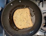 A picture of step 2 of Eggy bread with strawberries and maple syrup.