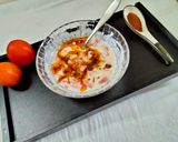 A picture of step 4 of Tomato Raita seasoned with Mustard seeds.