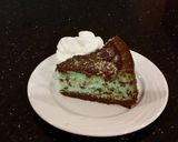 A picture of step 24 of Mint Chococolate Chip Cheesecake with a Fudge Brownie Crust.