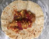 A picture of step 5 of Paratha kebabs wrap with egg.
