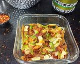 A picture of step 6 of Loaded Pizza fries.