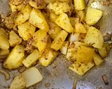 A picture of step 3 of Achari alu kadi rice.
