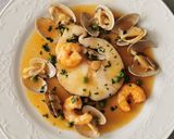 Foto del paso 7 de la receta Merluza a la vasca con langostinos