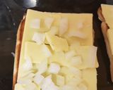 A picture of step 1 of My New style Of Cheese on toast with Sun dried Tomatoes. 😁.