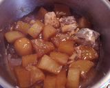 A picture of step 4 of Simmered Daikon and Canned Mackerel.