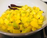 A picture of step 2 of Raw mango curry.