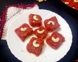 A picture of step 4 of Gajar Ka Halwa with milk and cashews.