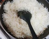 A picture of step 3 of Burnt chilli garlic rice with baked beans gravy.