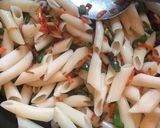 A picture of step 10 of Masala Chatpata Pasta.