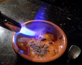 Foto del paso 5 de la receta: Kaki flambeado con wiski, coco rallado y salsa de maracuyá