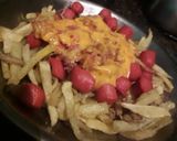Foto del paso 7 de la receta: Papas fritas con cheddar panceta y salchichas